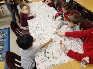 kids drawing at a table